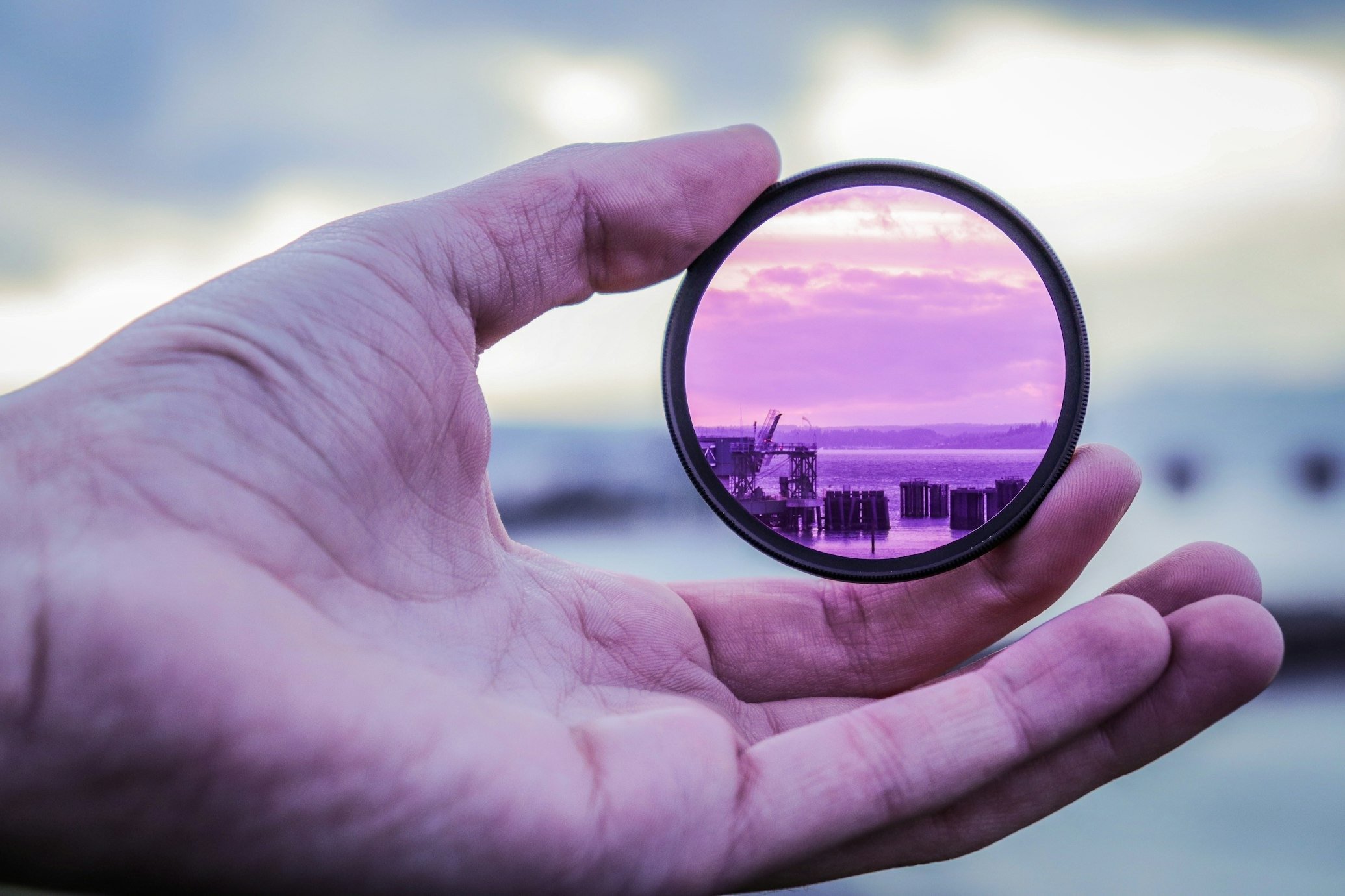 person holding lens